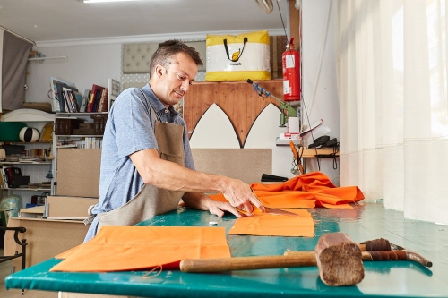 IMG_7544-Qualified-workman-upholstering-furniture-in-repair-furniture