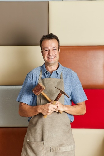 IMG_7645-Qualified-workman-upholstering-furniture-in-repair-furniture